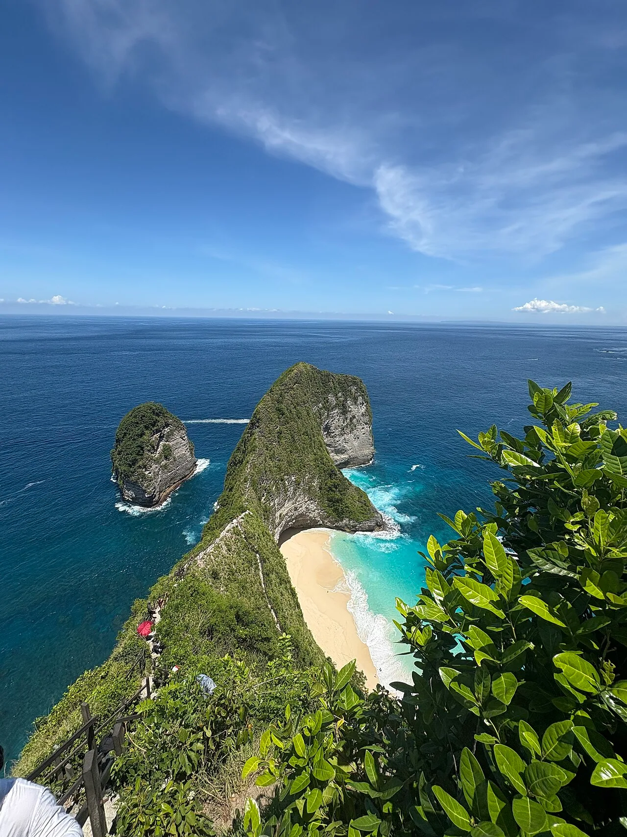 Traveler exploring Bali coastal cliffs